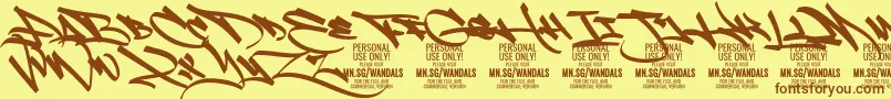 フォントFatWandals PERSONAL – 茶色の文字が黄色の背景にあります。