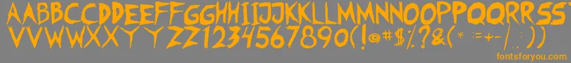 フォントFearless Coyne Shadow – オレンジの文字は灰色の背景にあります。