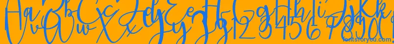 featrisse-Schriftart – Blaue Schriften auf orangefarbenem Hintergrund