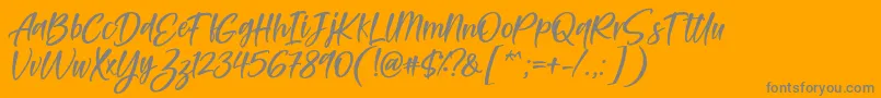 Feltarigo Font by 7NTypes Font – Gray Fonts on Orange Background