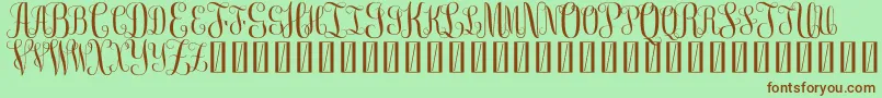 FreemonogramBeta0.5-Schriftart – Braune Schriften auf grünem Hintergrund