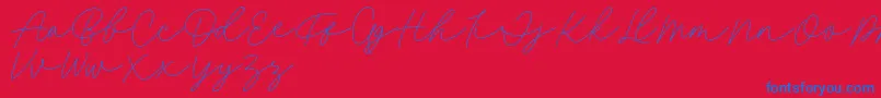Fillia Script FREE-Schriftart – Blaue Schriften auf rotem Hintergrund
