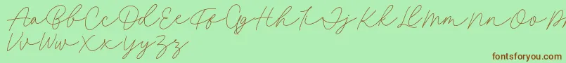 Fonte Fillia Script FREE – fontes marrons em um fundo verde