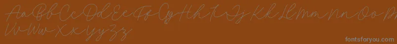 fuente Fillia Script FREE – Fuentes Grises Sobre Fondo Marrón