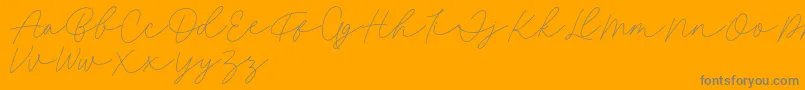 Fillia Script FREE-Schriftart – Graue Schriften auf orangefarbenem Hintergrund