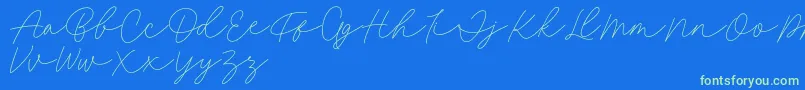 Fillia Script FREE-Schriftart – Grüne Schriften auf blauem Hintergrund