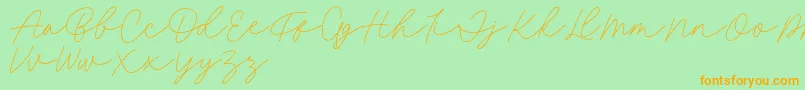 Fillia Script FREE-fontti – oranssit fontit vihreällä taustalla