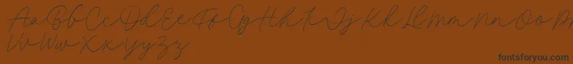 fuente Fillia Script FREE – Fuentes Negras Sobre Fondo Marrón