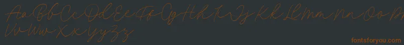 Fillia Script FREE-fontti – ruskeat fontit mustalla taustalla