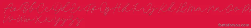 フォントFillia Script FREE – 赤い背景に灰色の文字