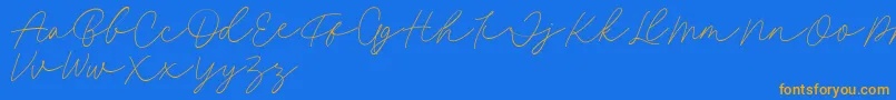 Fillia Script FREE Font – Orange Fonts on Blue Background