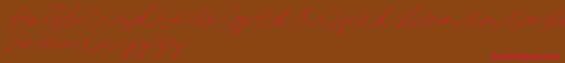 Fillia Script FREE Font – Red Fonts on Brown Background