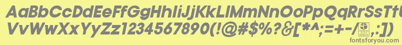TypoGotikaBlackItalicDemo-fontti – harmaat kirjasimet keltaisella taustalla