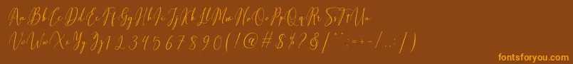 Fiolenitta-Schriftart – Orangefarbene Schriften auf braunem Hintergrund