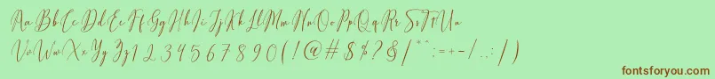 Fiolenitta Font – Brown Fonts on Green Background