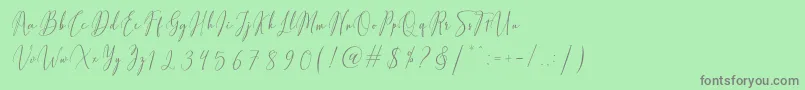 Fiolenitta-Schriftart – Graue Schriften auf grünem Hintergrund