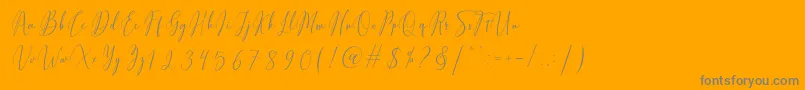 Fiolenitta-Schriftart – Graue Schriften auf orangefarbenem Hintergrund