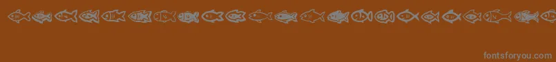 Fishes-Schriftart – Graue Schriften auf braunem Hintergrund