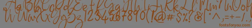 Flaming Carrot-Schriftart – Braune Schriften auf grauem Hintergrund