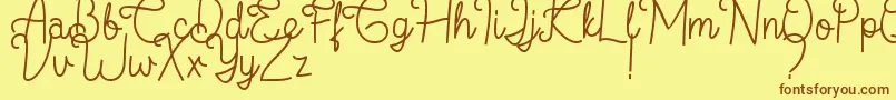 フォントFlamingo Regular – 茶色の文字が黄色の背景にあります。