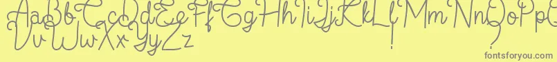 フォントFlamingo Regular – 黄色の背景に灰色の文字