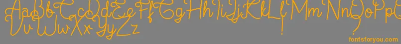 フォントFlamingo Regular – オレンジの文字は灰色の背景にあります。