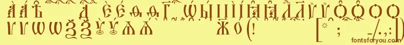 フォントIrmologionCapsKucsSpacedout – 茶色の文字が黄色の背景にあります。