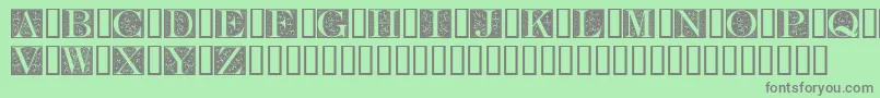 FleurCornerCaps Font – Gray Fonts on Green Background