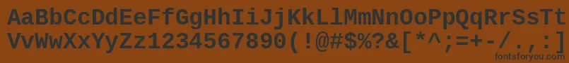 フォントCousineBold – 黒い文字が茶色の背景にあります