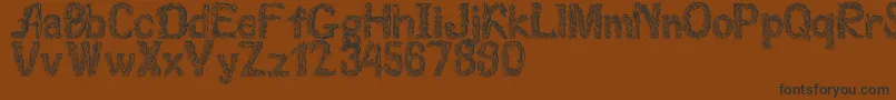 Florabet Font – Black Fonts on Brown Background