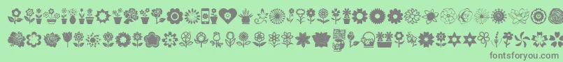 Fonte Flower Icons – fontes cinzas em um fundo verde