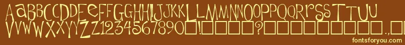 フォントFlowerchild Plain – 黄色のフォント、茶色の背景