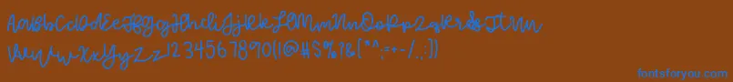 FoamyDessert-Schriftart – Blaue Schriften auf braunem Hintergrund