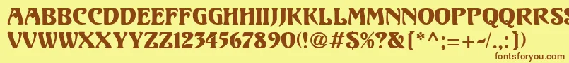 フォントUnicorn1 – 茶色の文字が黄色の背景にあります。