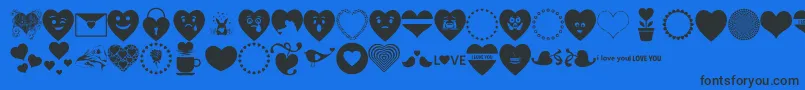Font Hearts Love-Schriftart – Schwarze Schriften auf blauem Hintergrund