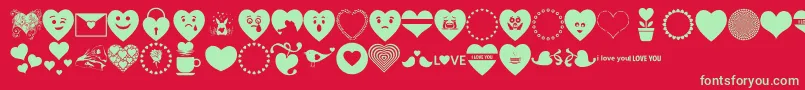 Fonte Font Hearts Love – fontes verdes em um fundo vermelho