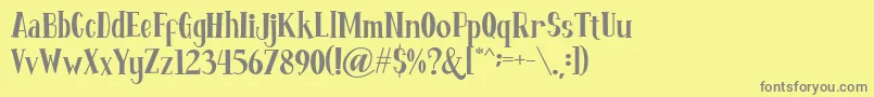 Fontastique-fontti – harmaat kirjasimet keltaisella taustalla