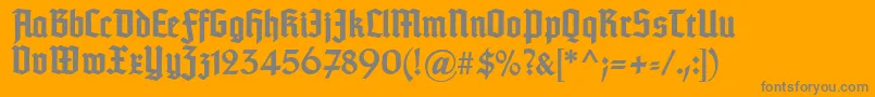 Fonte TypographertexturBold – fontes cinzas em um fundo laranja