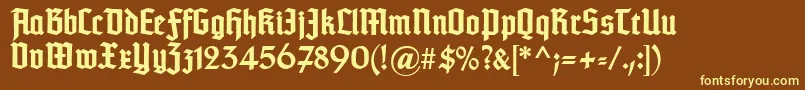 TypographertexturBold-fontti – keltaiset fontit ruskealla taustalla