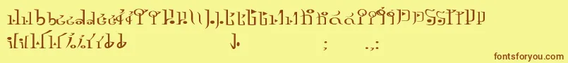 フォントTphylianGcnregular – 茶色の文字が黄色の背景にあります。