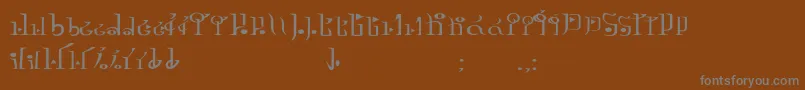 フォントTphylianGcnregular – 茶色の背景に灰色の文字