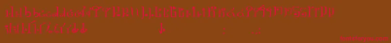 フォントTphylianGcnregular – 赤い文字が茶色の背景にあります。