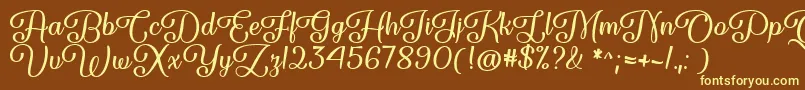 Fonte Forgiven Script   – fontes amarelas em um fundo marrom