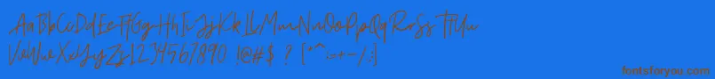 Fort Collins Script DEMO-Schriftart – Braune Schriften auf blauem Hintergrund