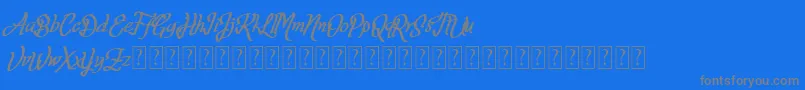 Fortuin FREE FOR PERSONAL USE-fontti – harmaat kirjasimet sinisellä taustalla