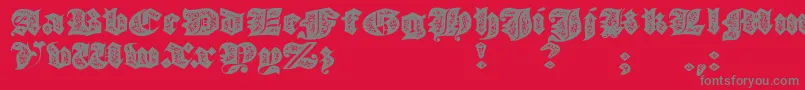 JmhMorenetaDivineOld-Schriftart – Graue Schriften auf rotem Hintergrund