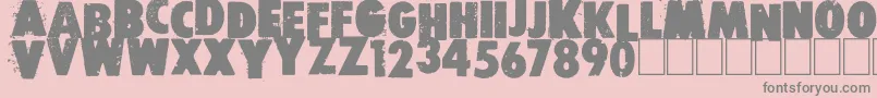Free press-fontti – harmaat kirjasimet vaaleanpunaisella taustalla