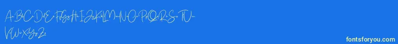 Free Yuminika Script-Schriftart – Gelbe Schriften auf blauem Hintergrund