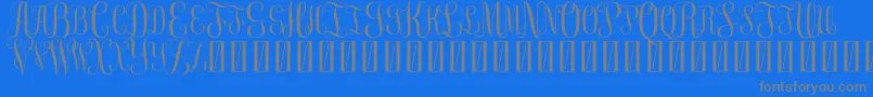 FreeMonogram Beta 0 5 Font – Gray Fonts on Blue Background