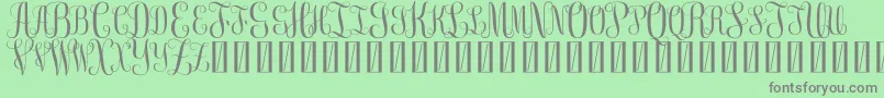 FreeMonogram Beta 0 5 Font – Gray Fonts on Green Background
